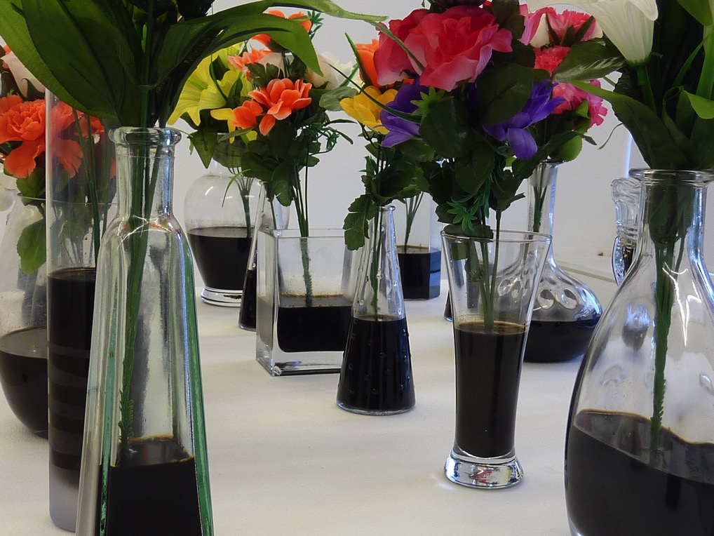 Garden of Eden — Close-up of the plastic flowers in crude-oil-filled vases